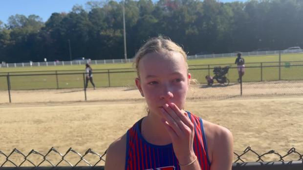 Athena Pluchos runs 11:28 leading wire to wire