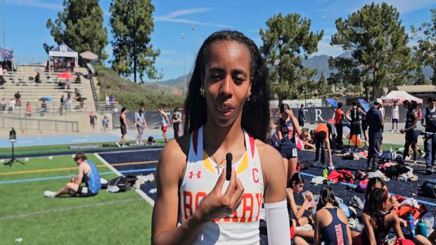 Justine Wilson (Rosary) 1st 400m (55.49)